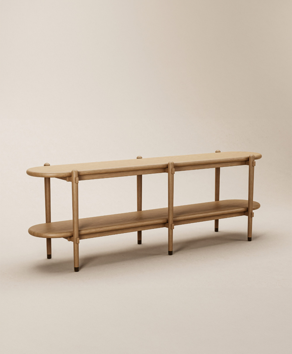 A minimalist, light wood bench with two oval-shaped tiers and rounded edges, supported by cylindrical legs, set against a plain, neutral background.