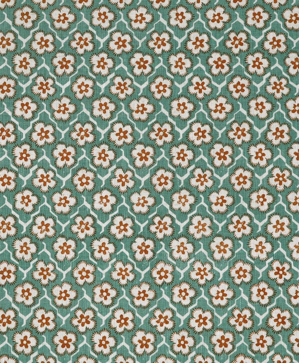 Repeating floral pattern with small white and brown flowers and green leaves, set against a light blue background. The flowers are evenly spaced, creating a symmetrical and vintage-inspired design.