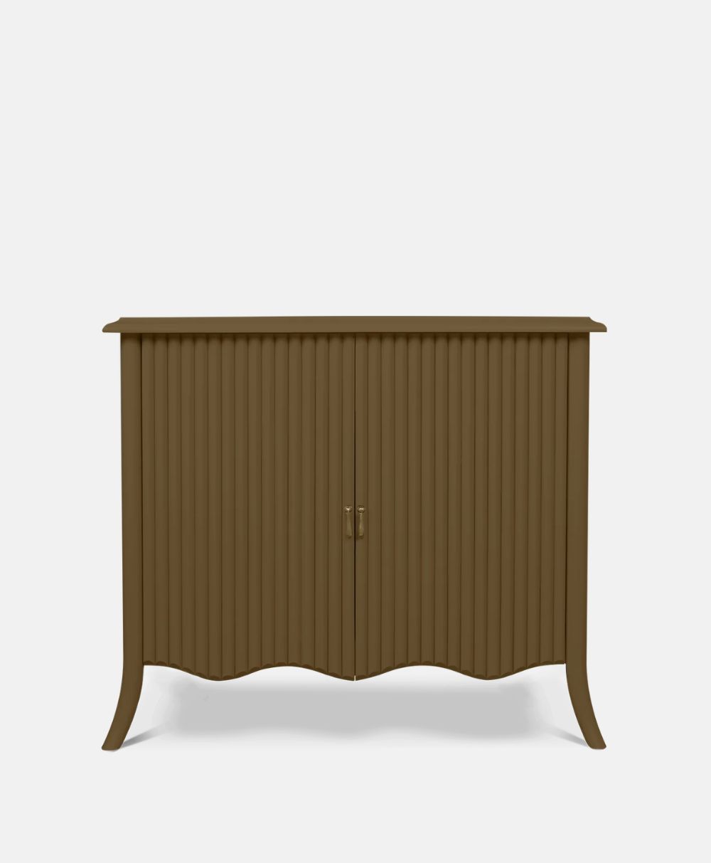 A brown wooden cabinet with vertical grooves, two central doors with a handle, and slightly curved legs and base, set against a plain white background.