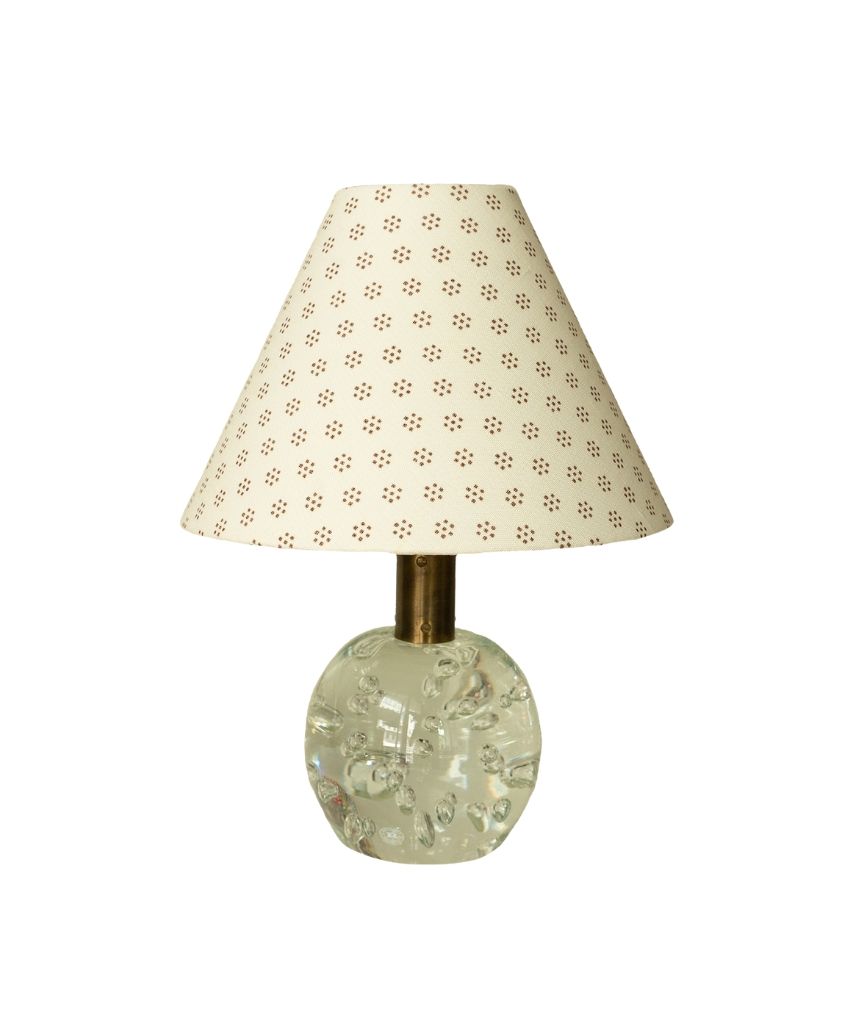 Cathy Nordström small cream coned lampshade with tobacco brown Dutch Dot print, on a clear glass bubble lamp base with brass stem