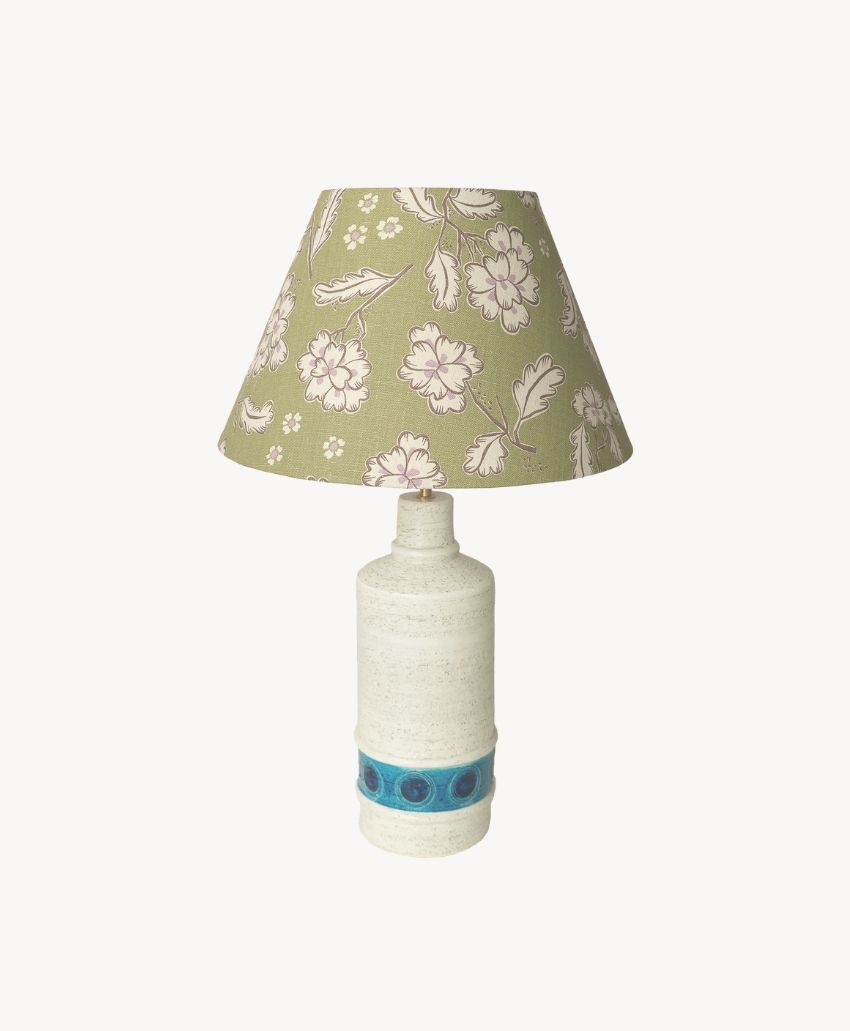 Cathy Nordström large Ingrid Khaki lampshade with a pale floral print on olive green, on a white ceramic lamp base with a blue band