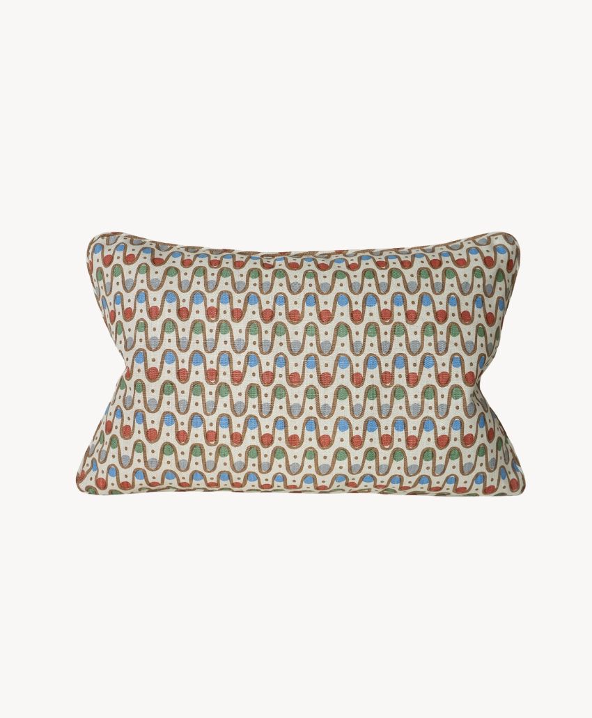 Cathy Nordström Iteru Desher Red rectangular cushion cover, 60 x 40cm, with a wavy geometric pattern in red, blue and green on cream