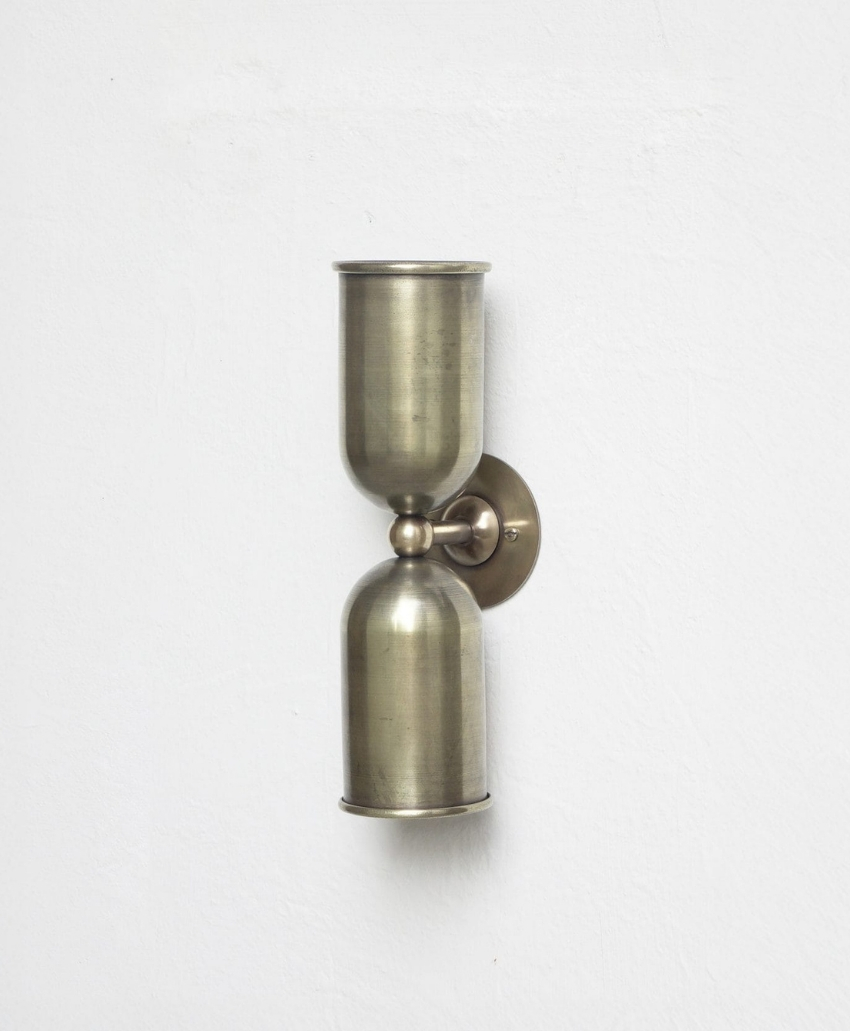 Fosbery Studio Orkney Wall Light in Brass, UK, Scheme Interior, a decorative wall light with brass detailing.