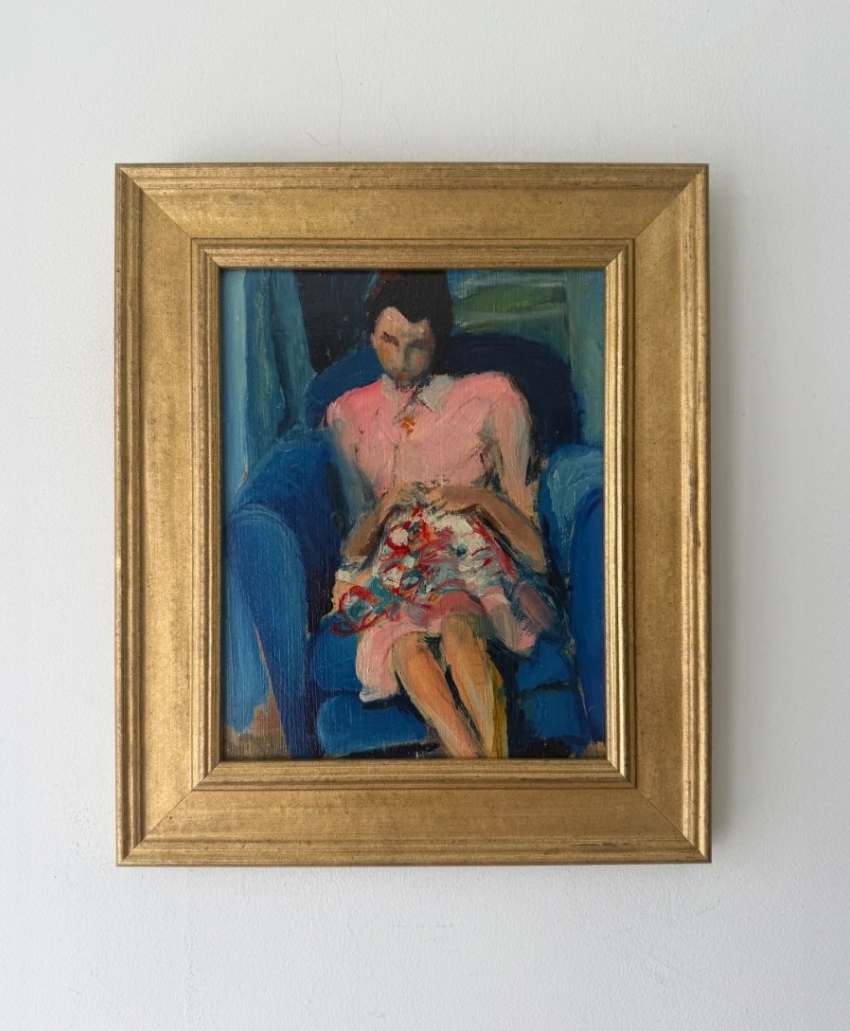 Hue + Holasz, Woman Knitting, muted blue, green and warm neutral tones, a woman knitting while seated in a deep blue armchair, Scheme, Interior, UK
