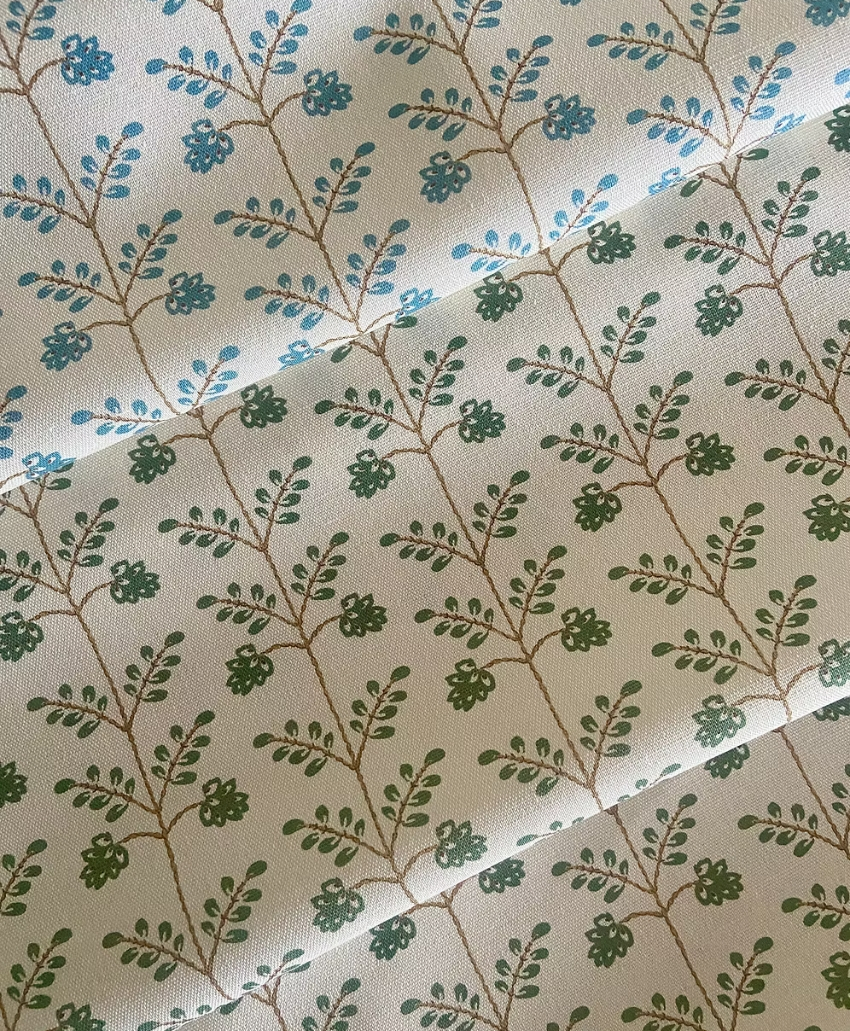 Kate Medlicott Leaf Trellis Fabric in Antique Blue, UK, Scheme Interior, a decorative fabric featuring a repeating leaf and trellis pattern in muted blue tones.