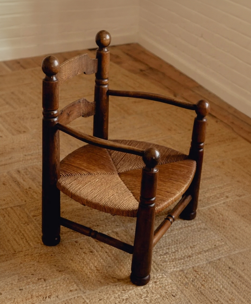 Passé The Store Low Rush Side Armchairs by Charles Dudouyt in Brown Wood, UK, Scheme Interior, vintage wooden armchairs with woven rush seats.