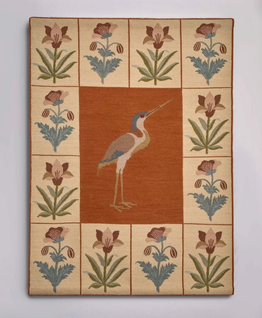 Muraqqa II, UK, Scheme Interior, a decorative woven textile featuring red, green and yellow patterns, from Pelican House.